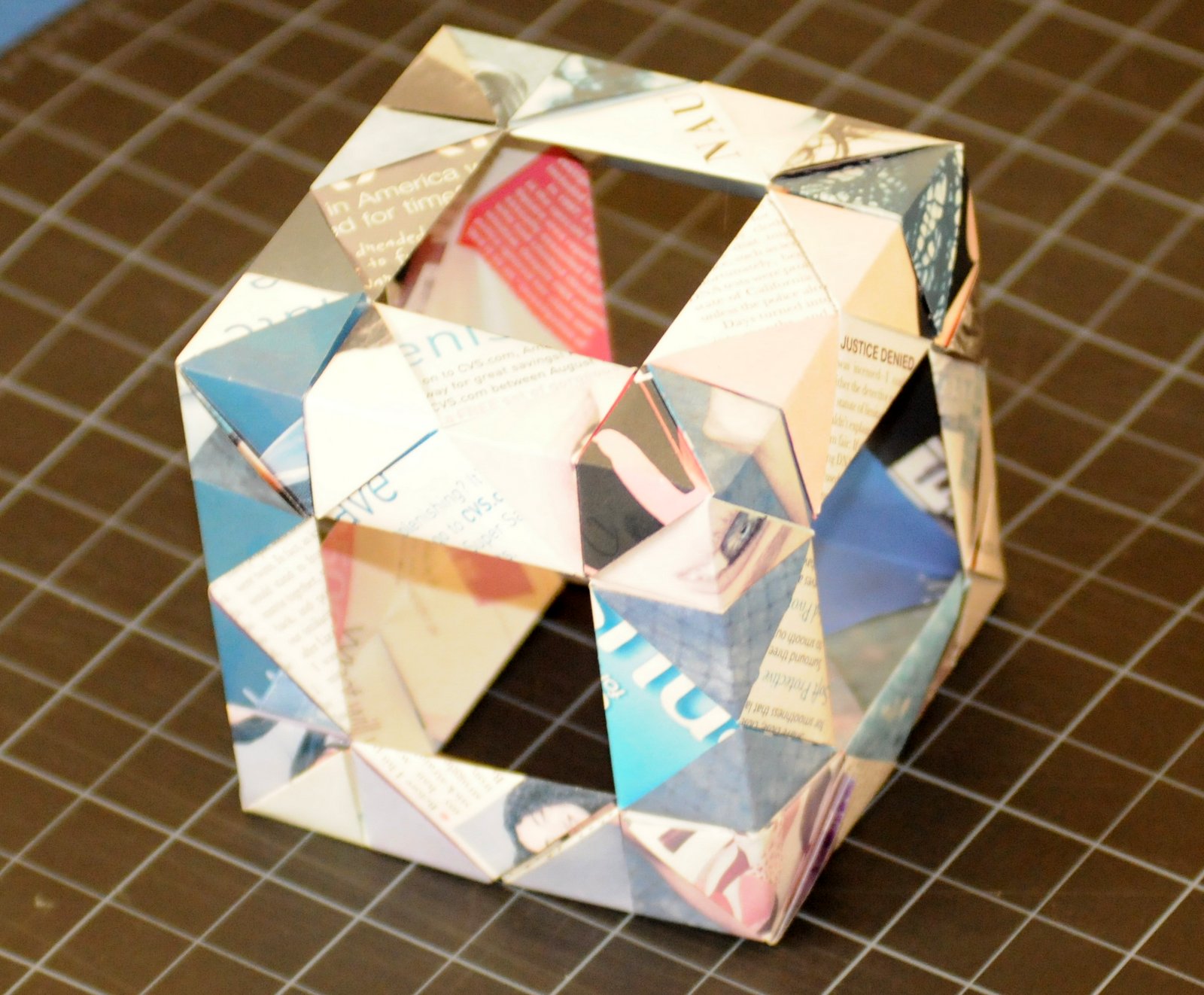 a cube shape made out of folded paper elements