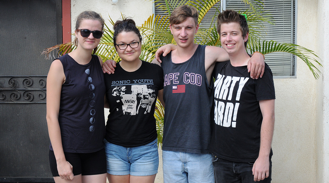 Uršulė, Greta, Lukas & Kristian from Lithuania & Slovakia standing together in front of my house in California