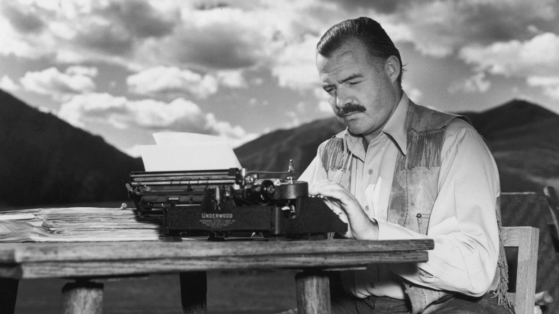 photo of Ernest Hemingway at a typerwiter