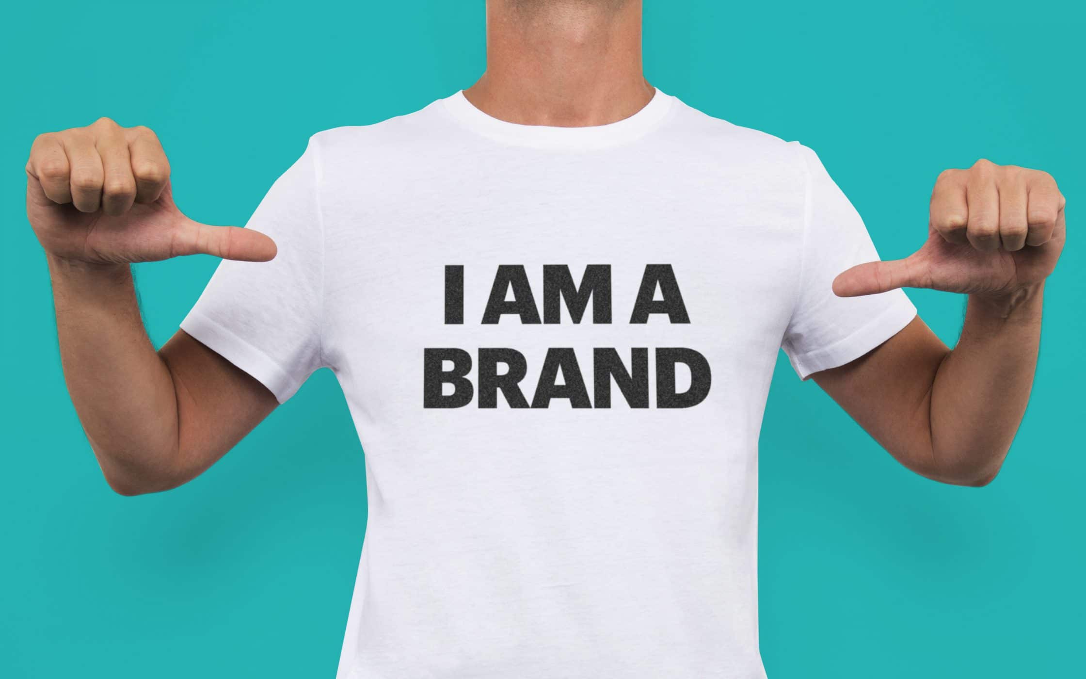 photo of a guy wearing a t-shirt with the text "I am a brand"