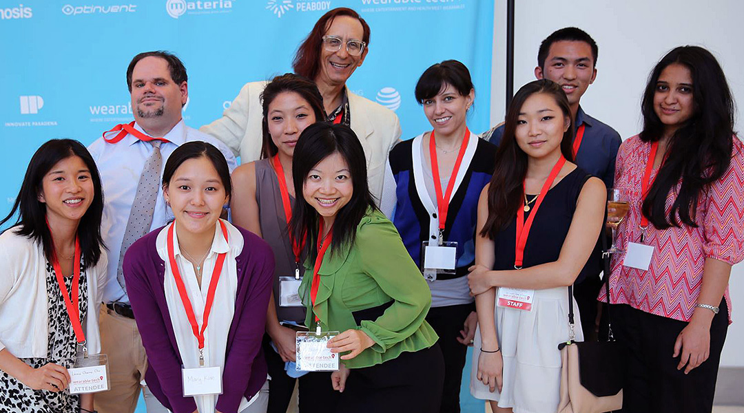 Members of Teams Allia, Compass H2O & Emoty from Media Design Practice's Extreme Wearables Designathon, relaxing after presenting their work at Wearable Tech LA at the Pasadena Convention Center on July 17, 2014