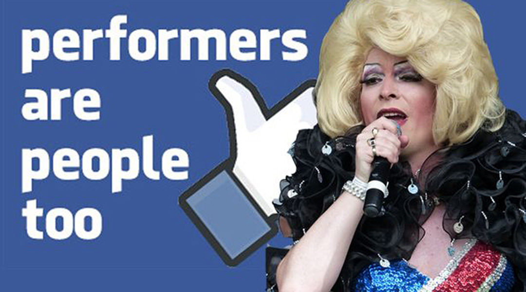 photo of a Drag Queen in front of a poster in "Facebook Blue" that reads "Performers are people too"