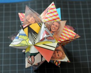 paper model of an icosahedron with each face articulated by a tetrahedron