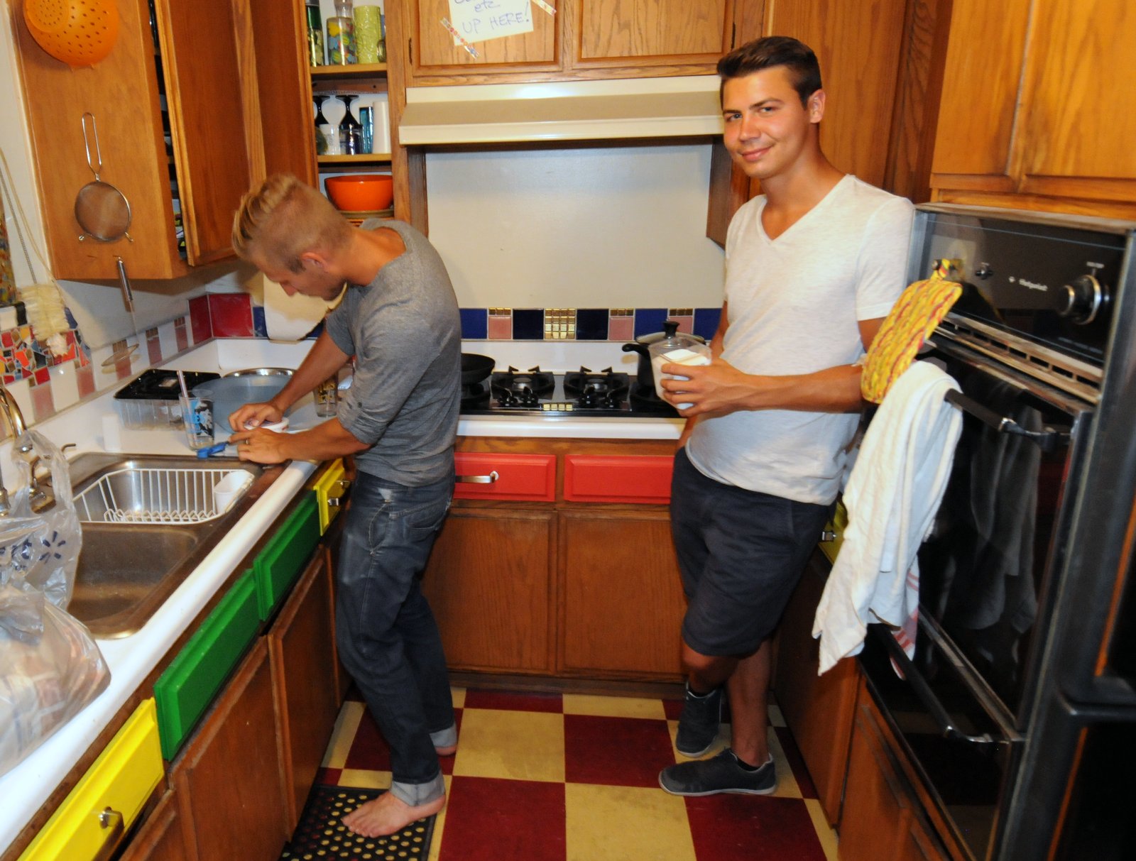 2 people in a tiny kitchen