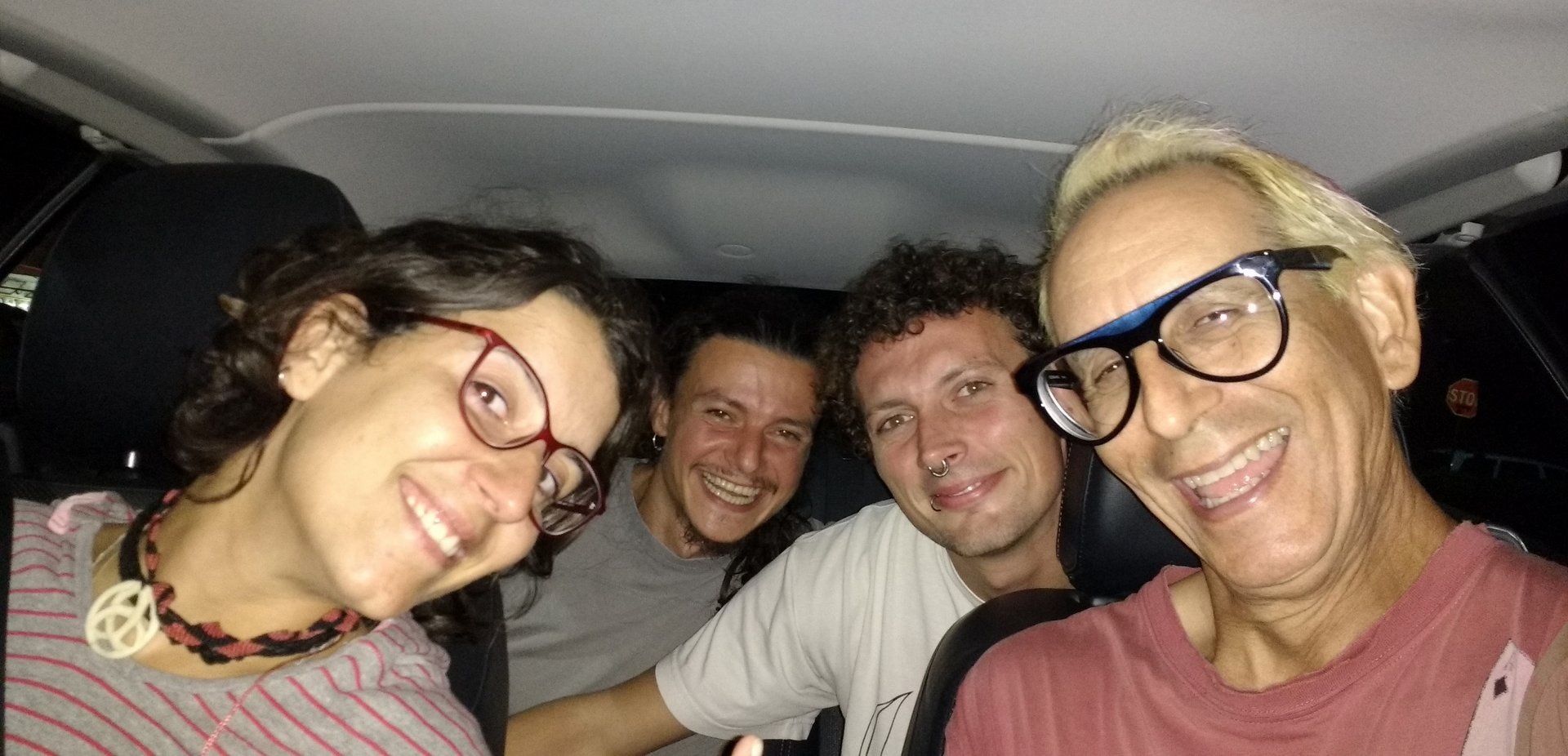 selfie of 4 people inside a car