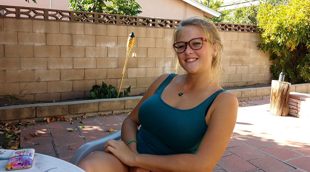 Stefanie Kuisle sitting in the backyard