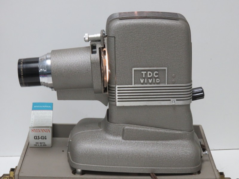Photo of a TDC Vivid projector with a Sylvania CLS-CLG 300 watt lamp box next to it.