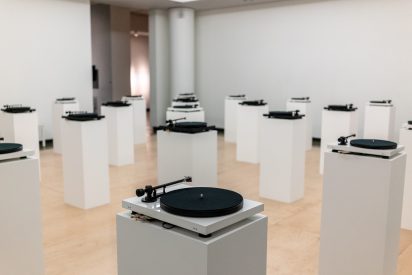 rows of turntables on pedestals in the main gallery of Long Beach State University's University Art Museum