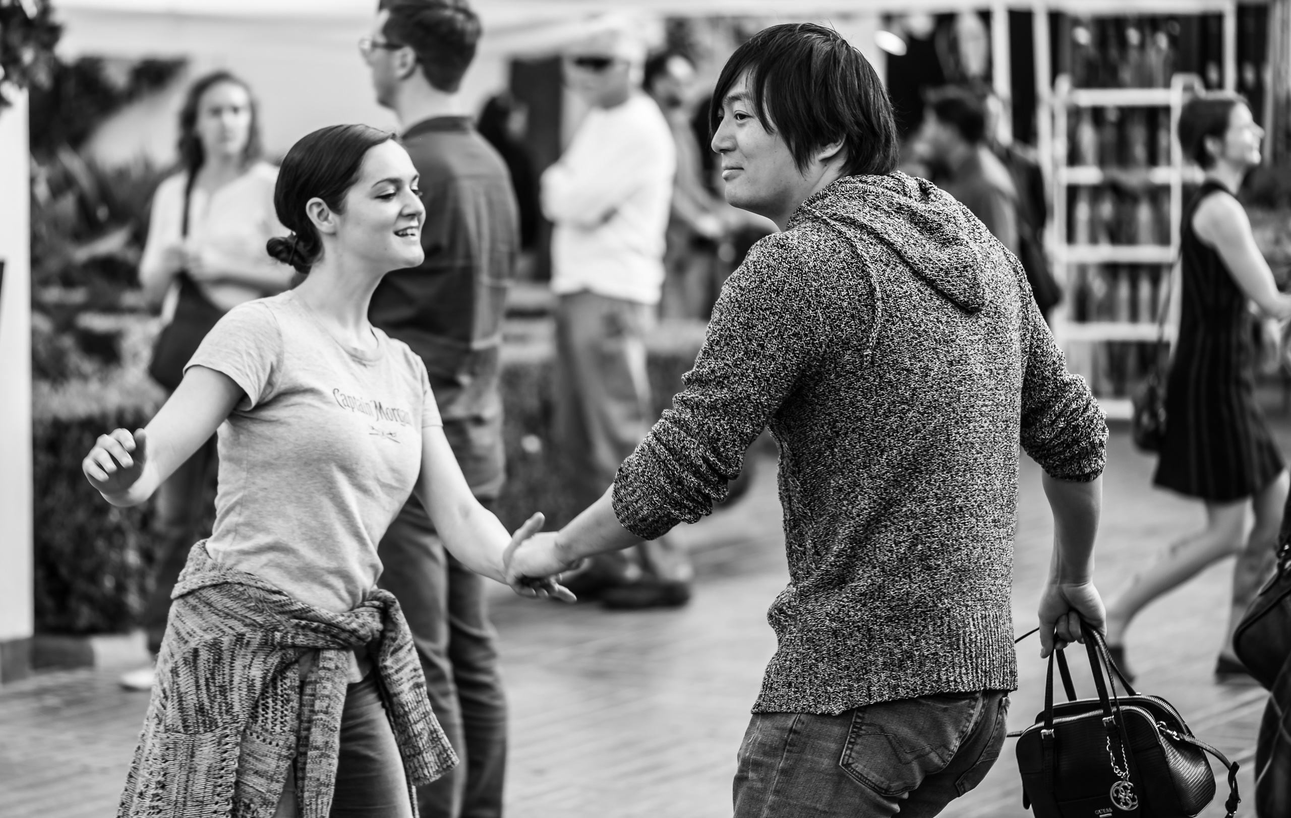 a couple swing dancing in an open-air courtyard at Union Station in Downtown Los Angeles