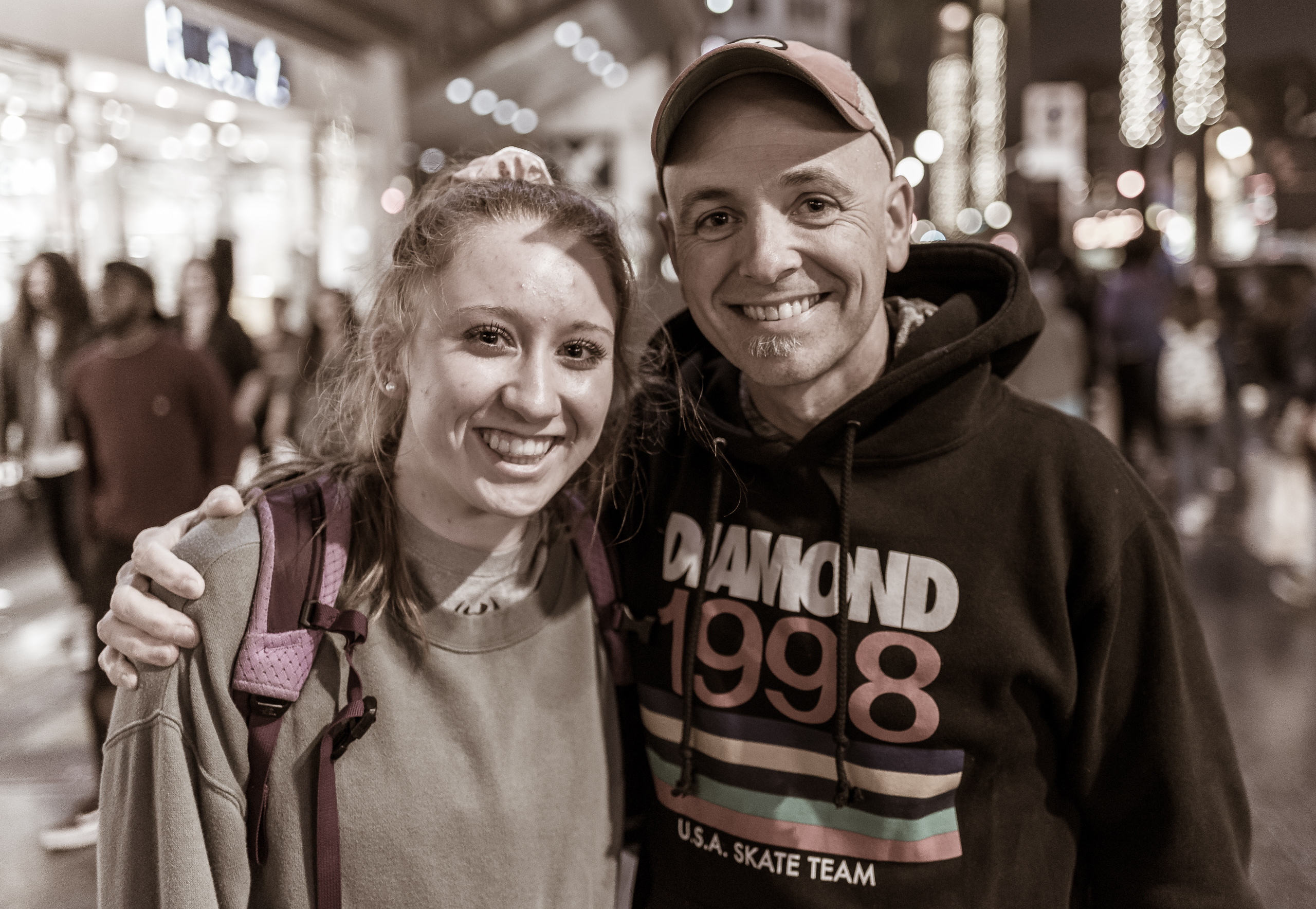 Olivia & Rich: a high school student of about 16 or 17 and one of her group leaders in his 20s or 30s. They're on a trip from a 200 student Christian High School in Lubbock, Texas. Their group of 31 has been speaking to the people on Hollywood Blvd, and here they take some time out to talk with me