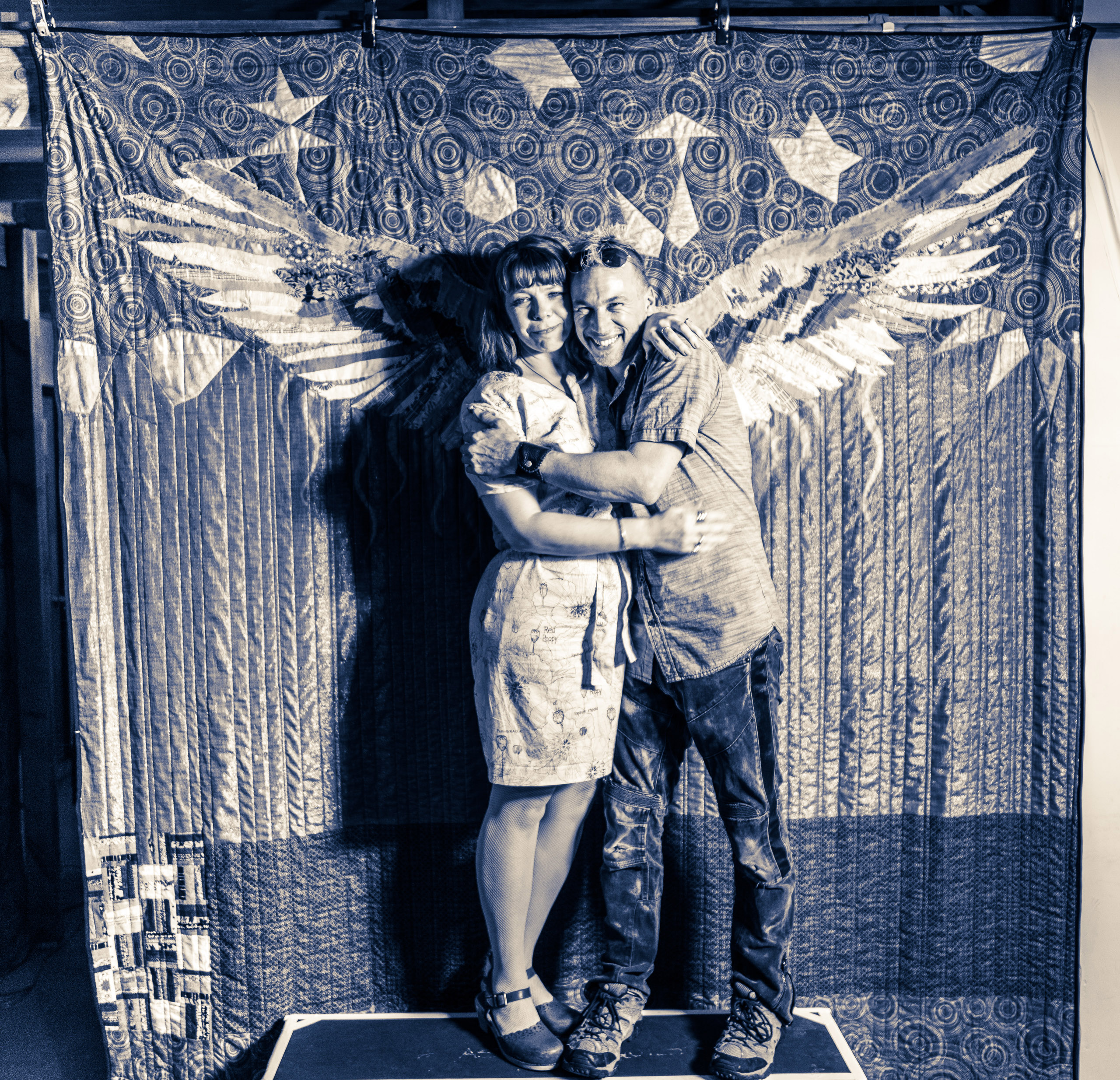 Jason "Hawke" Hamilton and Teresa Coates standing in front of their Ascension Quilt in Hamilton's loft at the Brewery Arts Colony in Downtown Los Angeles