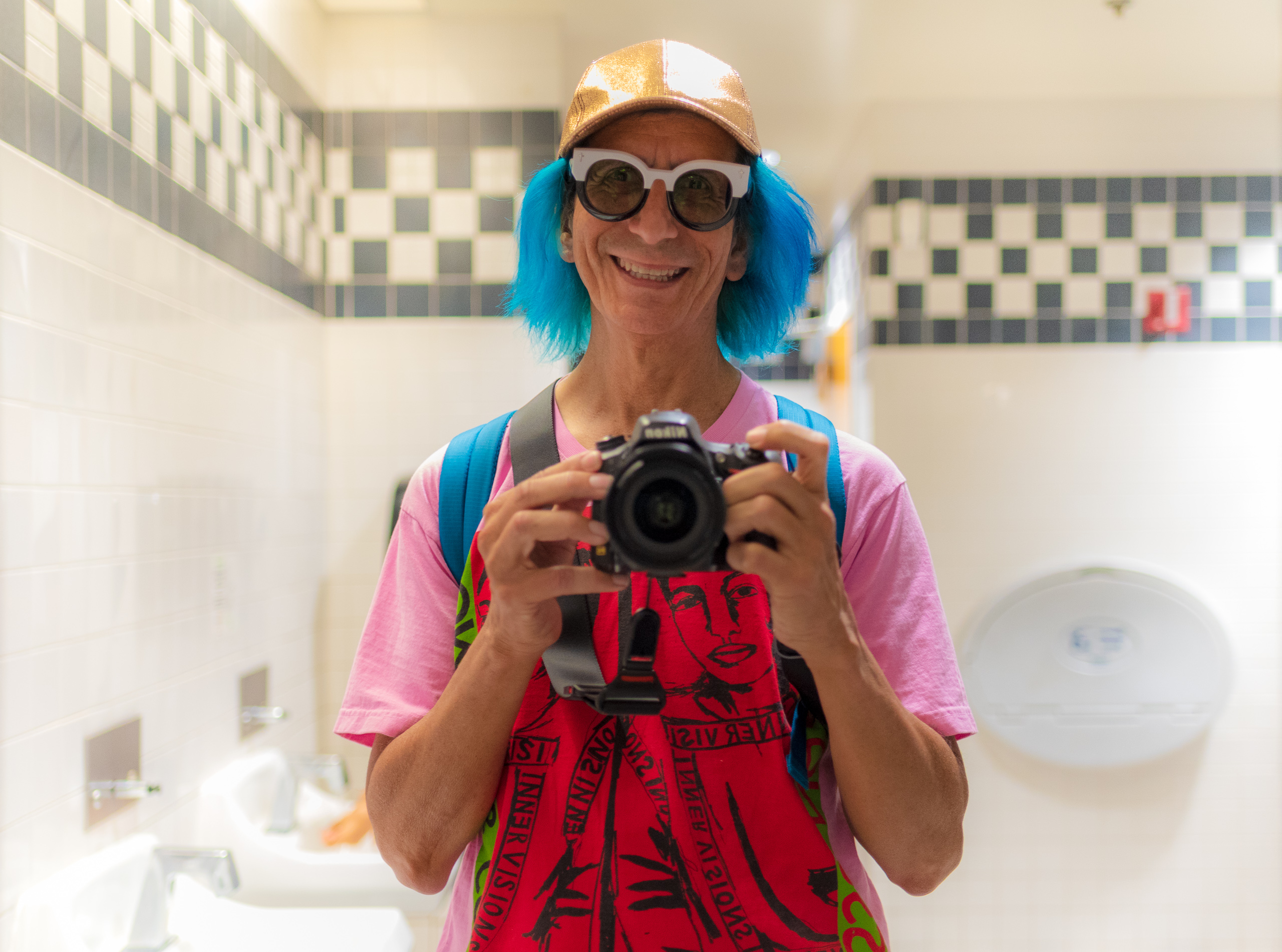 Glenn Zucman taking a selfie in the mirror of the men's restroom at the California Science Center in Exposition Park in Los Angeles