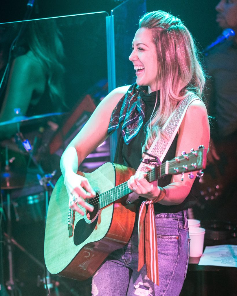Colbie Caillat Laughs During An Exchange With Bandmate Nelly Joy During Gone West's Debut Performance At The Troubadour In West Hollywood, CA On Friday, May 10, 2019. Gone West Is A New Nashville-Based Band Featuring 2-Time Grammy Award Winner Colbie Caillat, Multi-Platinum Singer/Songwriter Jason Reeves, 4-Time Hawaii Music Award Winner Justin Kawika Young And ACM And CMT Nominated Artist Nelly Joy. (Glenn Zucman/The Corsair)