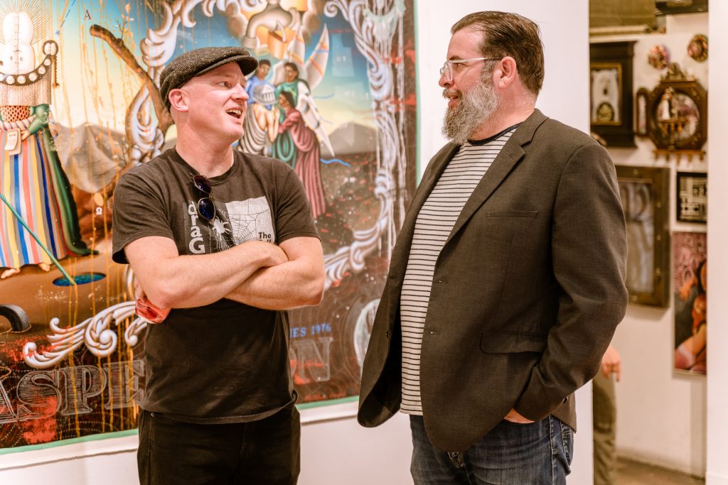 Artist Matthew Couper And La Luz De Jesus Gallery Director Matthew Gardocki Talk In Front Of Couper's Large Painting The Final Aspersion, 2018, At The Opening Of Couper's Exhibition In Memory Of Water At La Luz De Jesus Gallery In Los Angeles On Friday, May 3, 2019. Two Shows Are Running At La Luz De Jesus From May 3 To June 2: Matthew Couper's Solo Exhibition In Memory Of Water, And The Group Portrait Show Onward Featuring Artists Michele Melcher, Baldur Helgason, Yeo Kaa, Valery Pobjoy, And Sung Jik Yang. (Glenn Zucman/The Corsair)