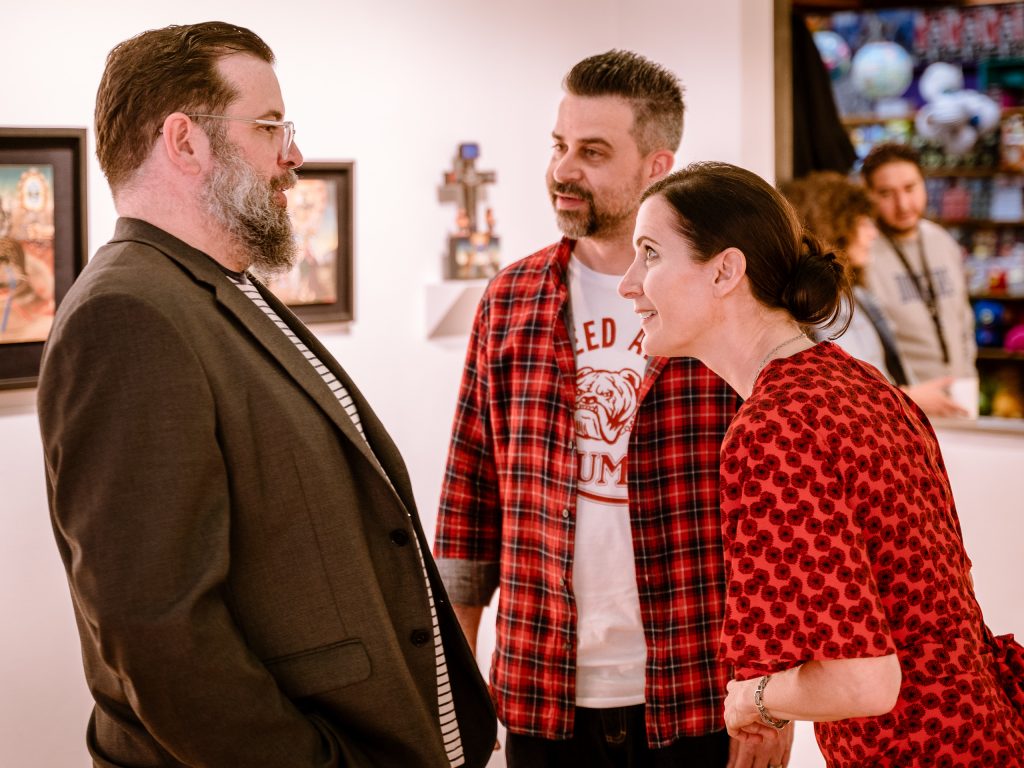 Gallery Director Matthew Gardocki (Left), Exhibiting Artist Michele Melcher (Right) And Melcher's Husband, Brand Designer Brian Isserman (Center) In Conversation At The Opening Of Onward, A Group Portrait Show That Features Four Of Melcher's Intimate, Neo-Baroque Portraits In Precious Victorian Frames, At La Luz De Jesus Gallery On Friday, May 3, 2019.