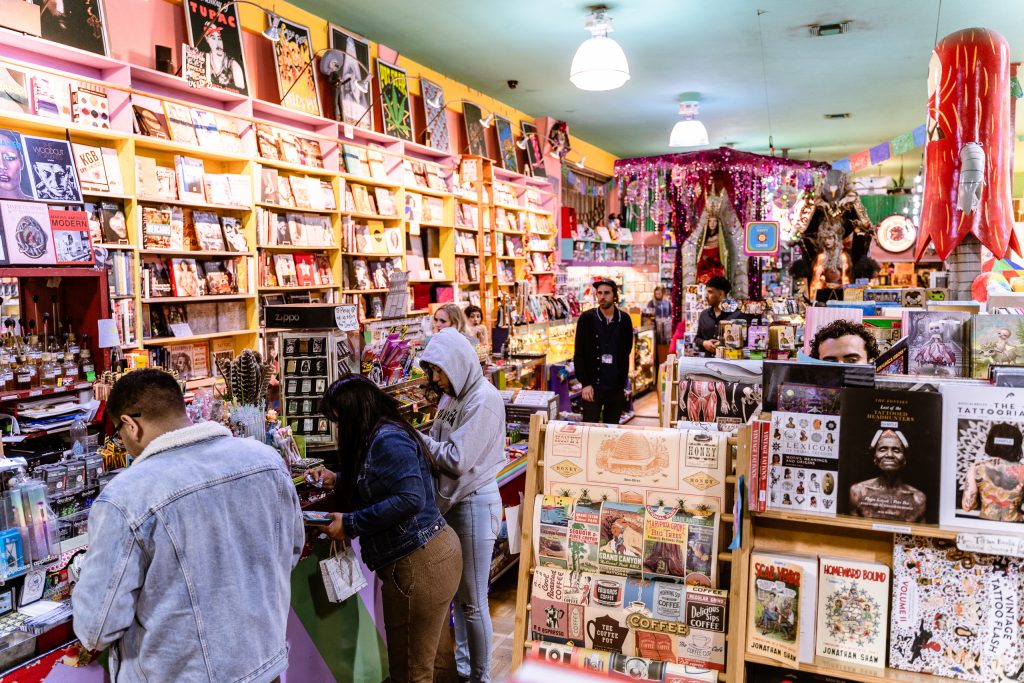 Interior View Of The Books, Posters, Gifts, Toys, And Curiosities Available At The Densely Packed Shop Wacko, Part Of Owner Billy Shire's Triad With Soap Plant And La Luz De Jesus Gallery, All Located At 4633 Hollywood Blvd. In The Los Feliz District Of Los Angeles On Friday, May 3, 2019. This Is The Fourth Location For Shire's Ongoing Pop Culture Venture Which Started As Soap Plant, A Project By Shire's Parents Barbara And Hank Shire In 1971. Shire's Mother Sold Her Hand-Crafted Soaps, His Father Designed Graphics And Ran The Store, His Brother Peter Shire Made Ceramics, And Billy Shire Made Leatherware That Sold To Clients Like The New York Dolls And Elton John. By 1984 Soap Plant Had Moved From Silverlake To Melrose, And Billy Shire, Now The Sole Owner Of Soap Plant, Added Wacko, A Shop Offering Postcards, Japanese Robots, Tin Wind-Ups, Ephemera, Games, And Novelties. In 1986 Shire Added A Third Branch, La Luz De Jesus Gallery, An Early Mover In The California "Lowbrow" Art Movement.  Juxtapose Magazine Would Eventually Declare Shire, “The Peggy Guggenheim Of Lowbrow.” In 1995 Shire Moved Soap Plant, Wacko, And La Luz De Jesus Gallery To Their Present Location In The Los Feliz District Of Los Angeles. (Glenn Zucman/The Corsair)