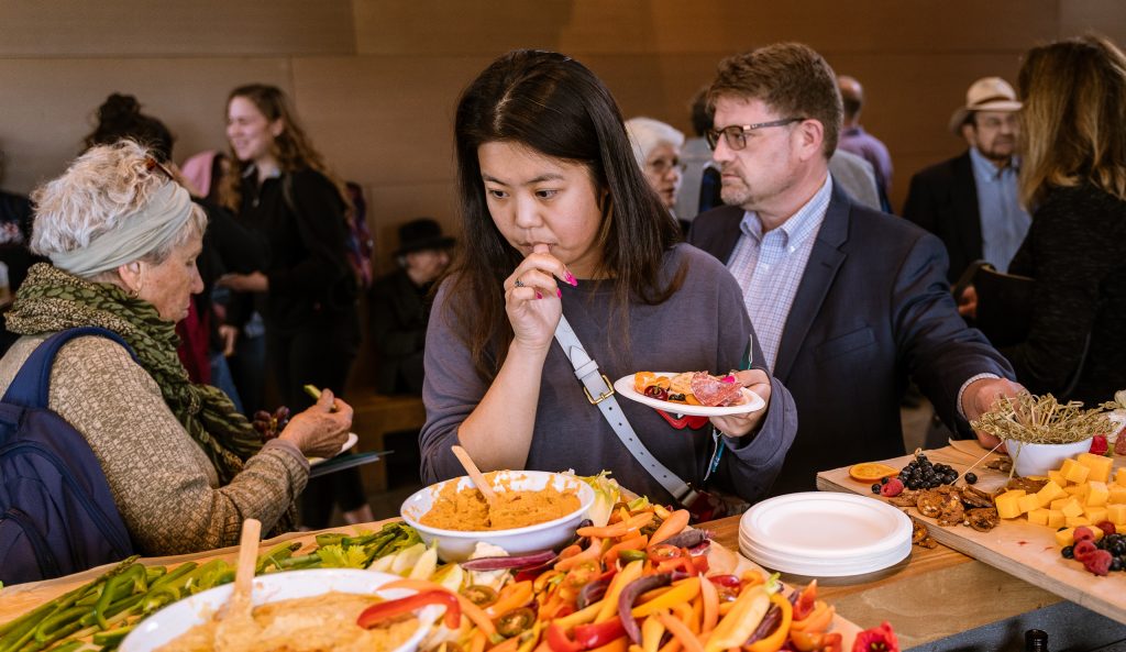 SMC Childhood Development Major Jiaying Song From Shijiazhuang, China Looks Over The Hors D'oeuvres At The Reception Before Tonight's Housing Discussion At The SMC Broad Stage On Thursday, May 9, 2019. Song Commutes To SMC From Monterey Park And Came Tonight Because Her SMC Political Science Instructor Offered Extra Credit. The SMC Public Policy Institute Is Presenting Its 8th Annual Spring Symposium, "There Goes The Neighborhood, Part II: How Might Policy Approaches Prevent Displacement In Neighborhoods Affected By Gentrification?" From May 4-9. Tonight's Final Event In The Series Is "Where Goes The Road To Solving California’s Housing Crisis? A Keynote Discussion With Legislative Leaders." The Panel Includes California State Legislators Senator Ben Allen (SD26 – Santa Monica) And Senator Scott Weiner (SD11 – San Francisco), Author Of SB 50 Which Proposes Bold Approaches To California’s Housing Issues, And Santa Monica Mayor Gleam Davis, A Former Co-Chair Of Santa Monicans For Renters’ Rights And Leading Advocate For Santa Monica’s Innovative Policy Solutions And Funding For Affordable Housing." (Glenn Zucman/The Corsair)