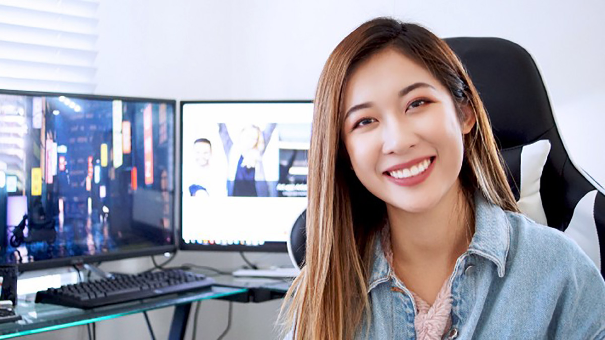portrait of artist Jade Nguyen at a computer workstation